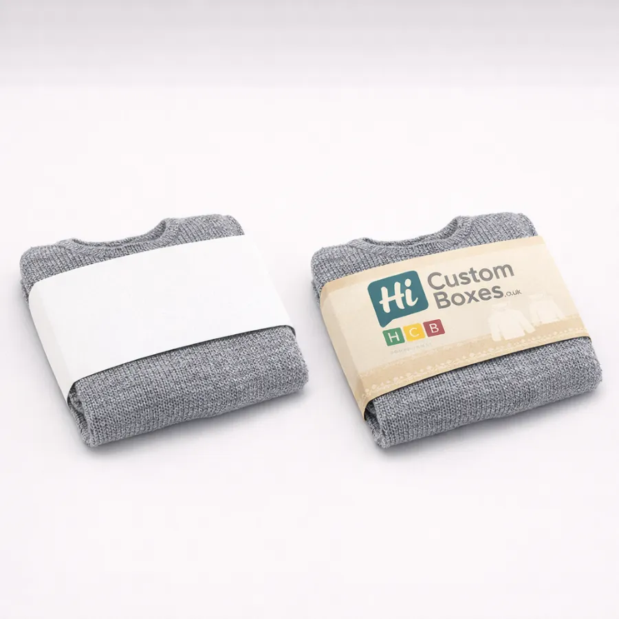 Folded grey jumpers secured with paper belly bands- featuring one plain and one branded design- class=